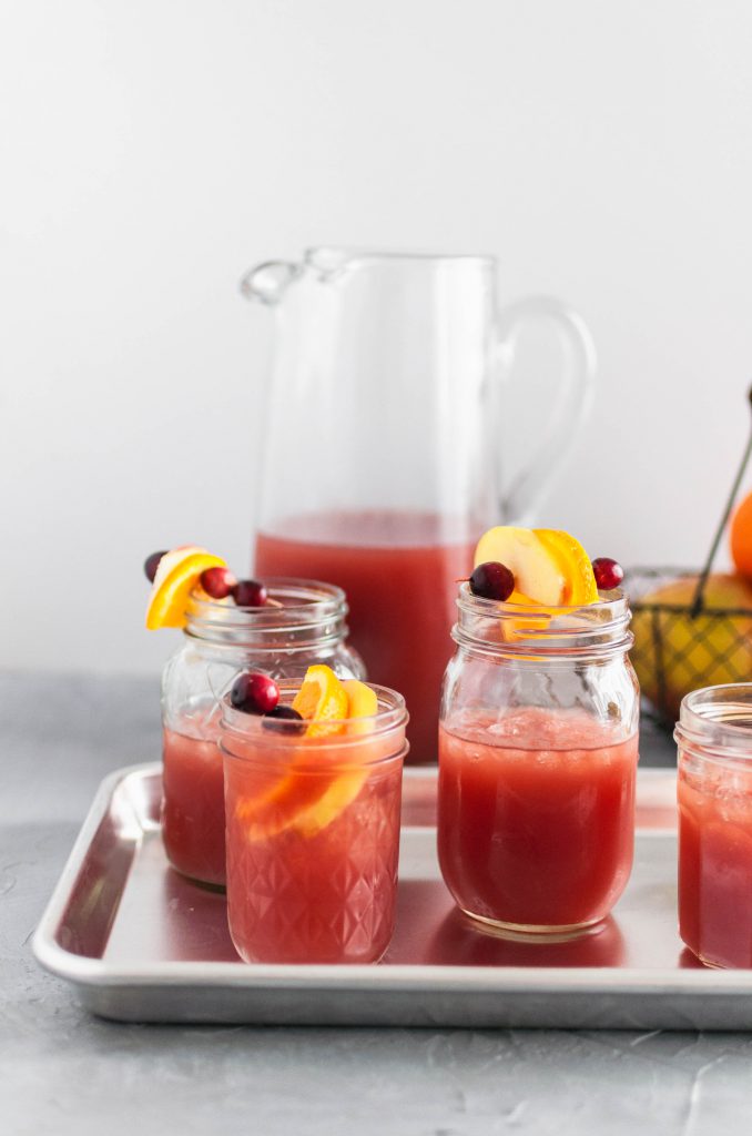 This Thanksgiving Punch is the perfect festive drink to serve on Thanksgiving. Cranberry juice, orange juice, apple cider and ginger beer create a deliciously addictive punch. Spiced rum optional.