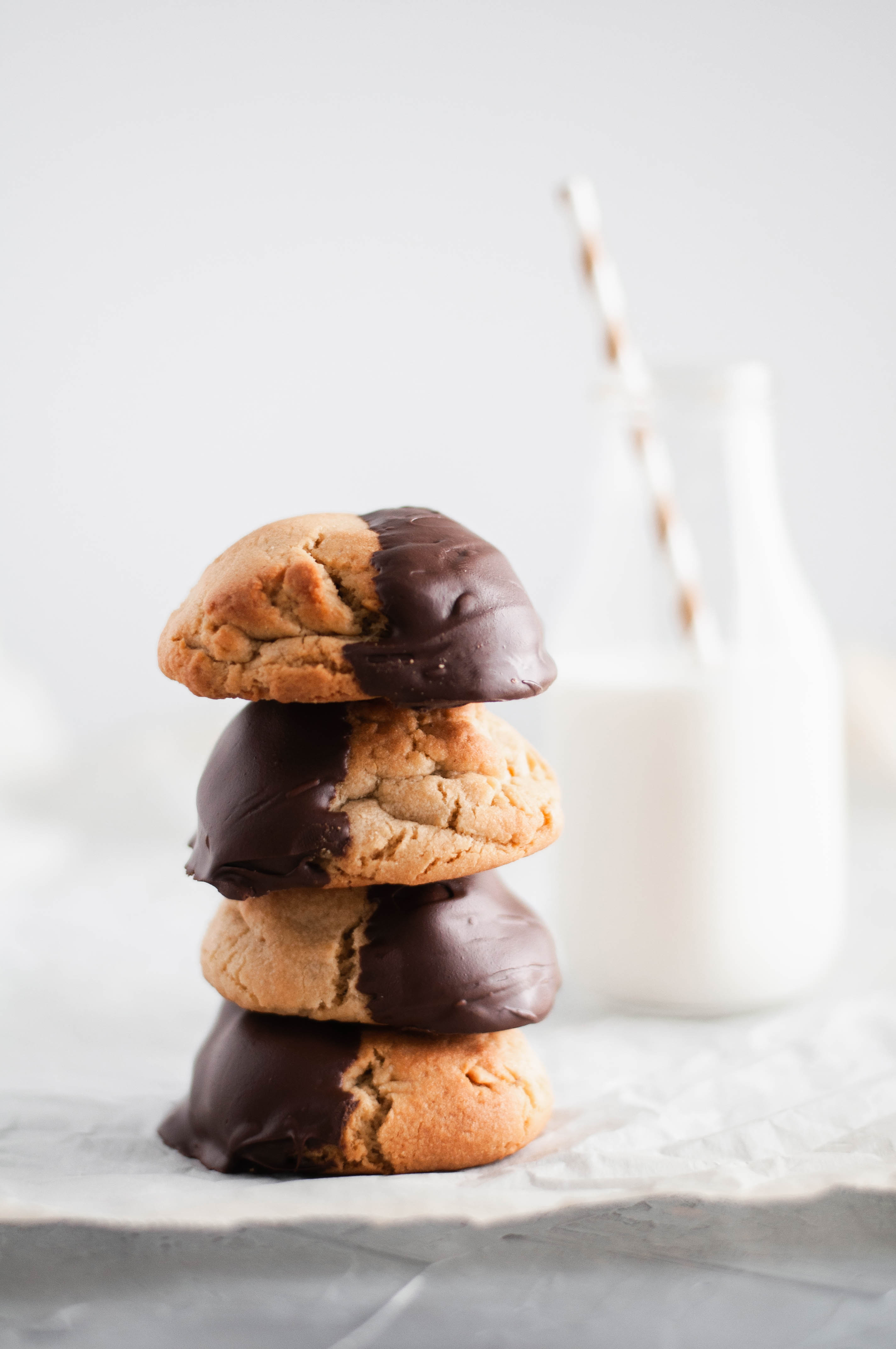 These giant Chocolate Peanut Butter Cookies are perfect for your Christmas cookie baking. Rich, chewy peanut butter cookies dipped in melted chocolate.
