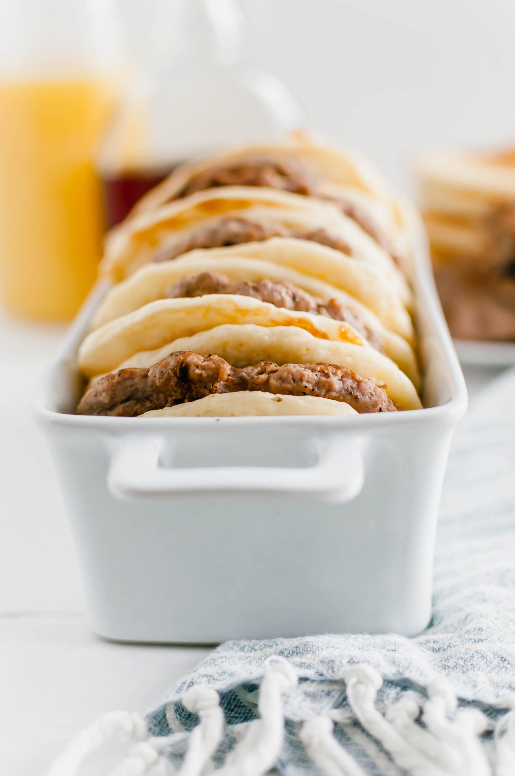 Turkey isn't just for dinner. This Turkey Sausage Breakfast Sandwich is super filling and will keep you energized all day. Juicy homemade turkey sausage patties sandwiched between two fluffy buttermilk pancakes. Maple syrup drizzle optional.