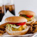 You don't need warm weather to enjoy a burger at home. These Sheet Pan Burgers and Fries are super simple to make all on one pan. A great, simple weeknight meal.