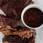 These Oven Baked Ribs are the ultimate in comfort. So simple and unbelievably tender. Rubbed with a delicious, rich coffee rub, baked then slathered in bbq sauce.