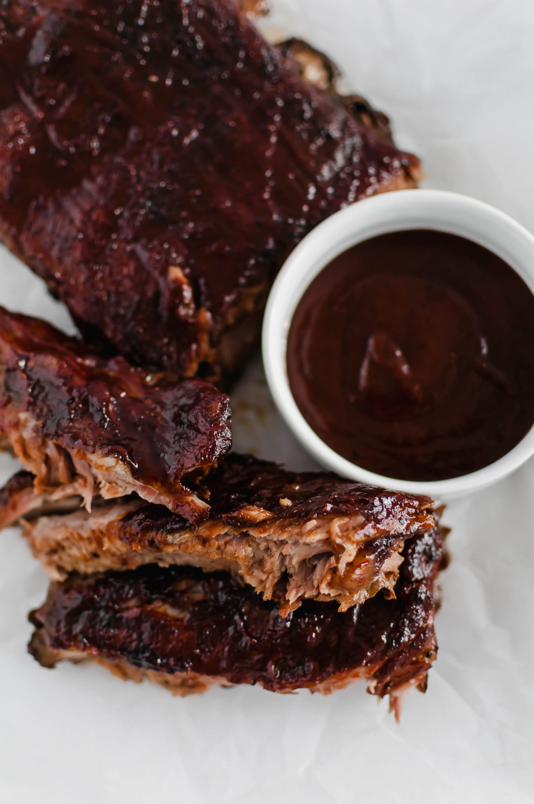 These Oven Baked Ribs are the ultimate in comfort. So simple and unbelievably tender. Rubbed with a delicious, rich coffee rub, baked then slathered in bbq sauce.