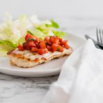 This Bruschetta Chicken comes together in less than 30 minutes for the perfect simple, healthy and fresh dinner. Perfectly seared chicken, lots of melted mozzarella and a super simple homemade bruschetta.