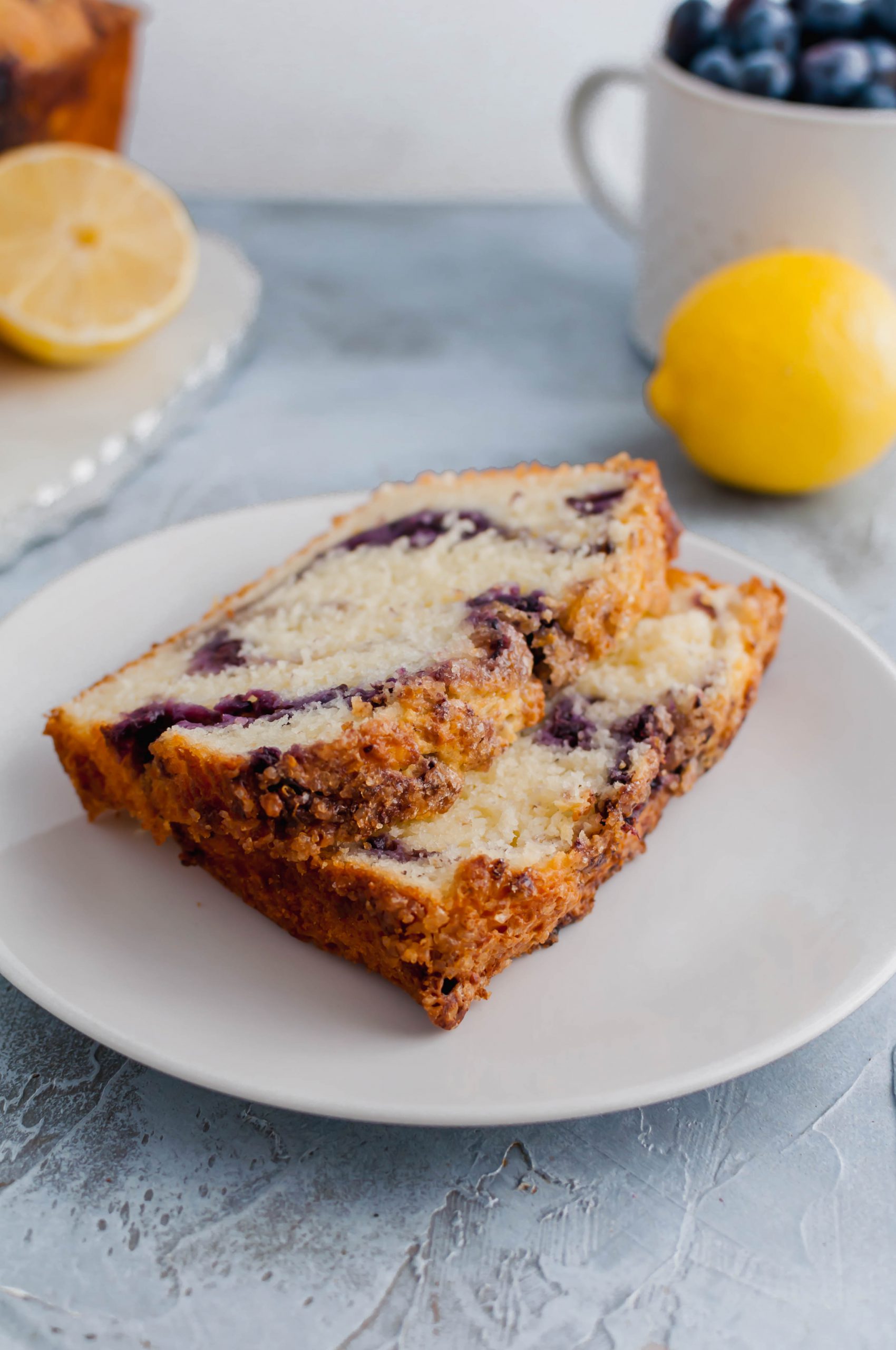 Blueberry Bread is a delicious breakfast option. Tender, moist quick bread swirled with homemade blueberry compote and topped with lemon sugar