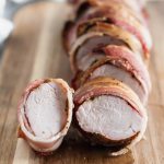 This Bacon Wrapped Pork Loin is fancy enough for guests but easy enough for weeknight meals. Packed with herbs and all the crispy bacon.