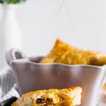 These Savory Turnovers are going to turn into your favorite brunch item. Flaky puff pastry filled with tender scrambled eggs, breakfast sausage and shredded sharp cheddar.