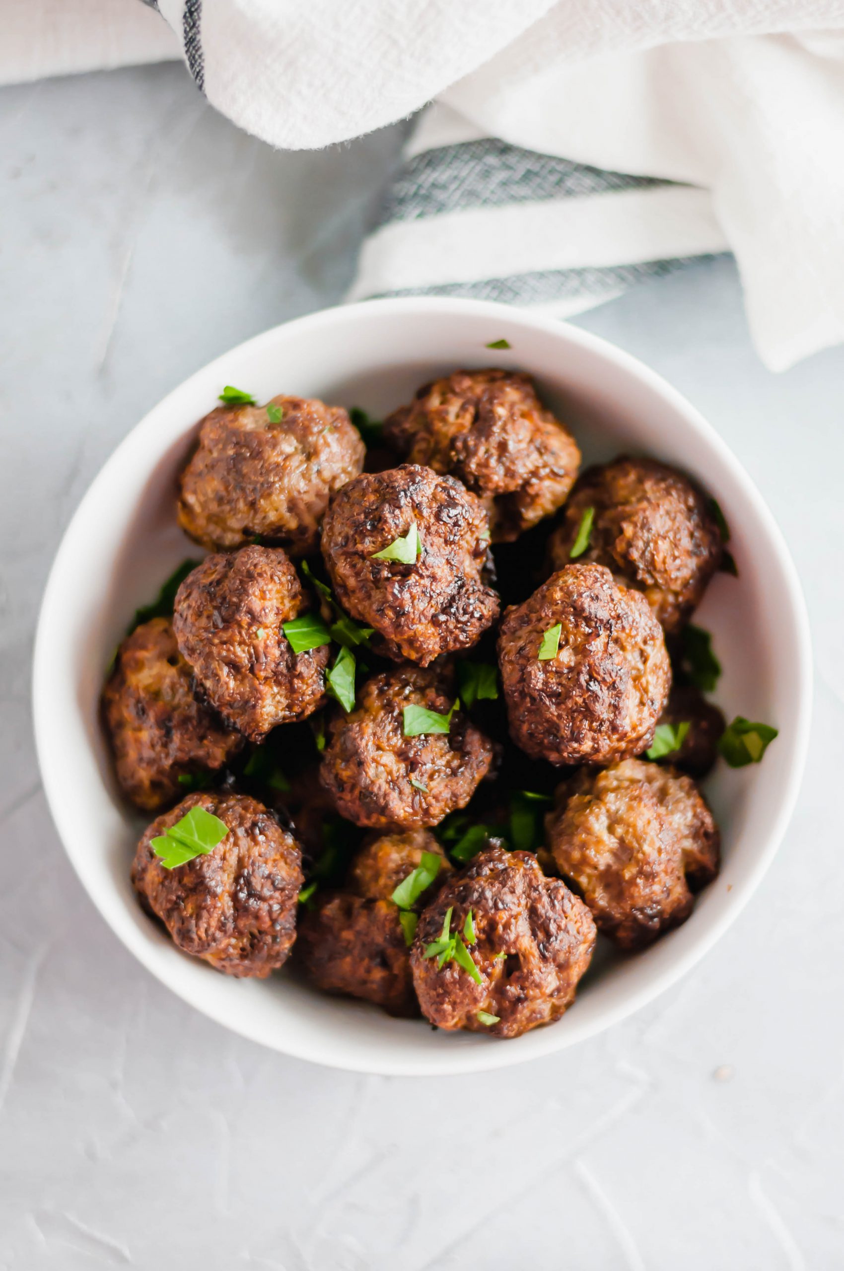 These Air Fryer Meatballs are the crispiest, juiciest meatballs ever. Super simple to make and done in minutes making a great option for weeknight meals.