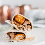 This Steak and Potato Burrito is stuffed with tender seared steak, crispy tater tots, blue cheese dressing and a drizzle of steak sauce. The perfect meal any time of the day.