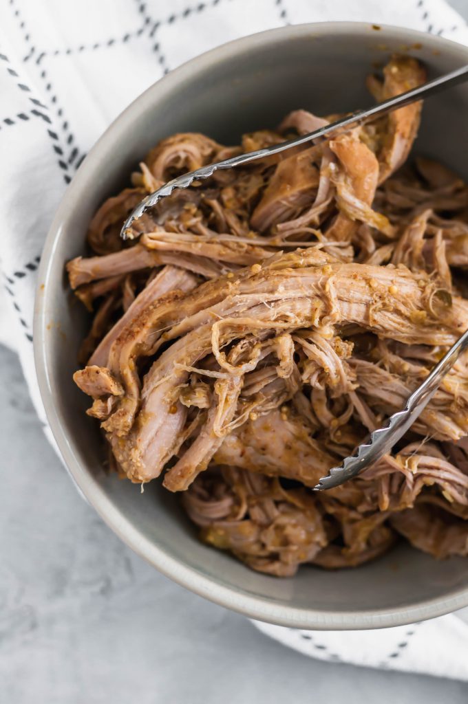This Slow Cooker Pork Verde is the easiest dinner around. A few simple spices and a jar of salsa verde spice up a lean pork loin in all the best ways. It will quickly become a go to dinner.