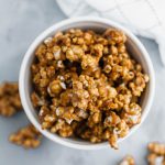 Salted caramel popcorn is the perfect addition to a party or movie night. It features a simple homemade caramel sauce, freshly popped popcorn and a hearty sprinkle of coarse salt.