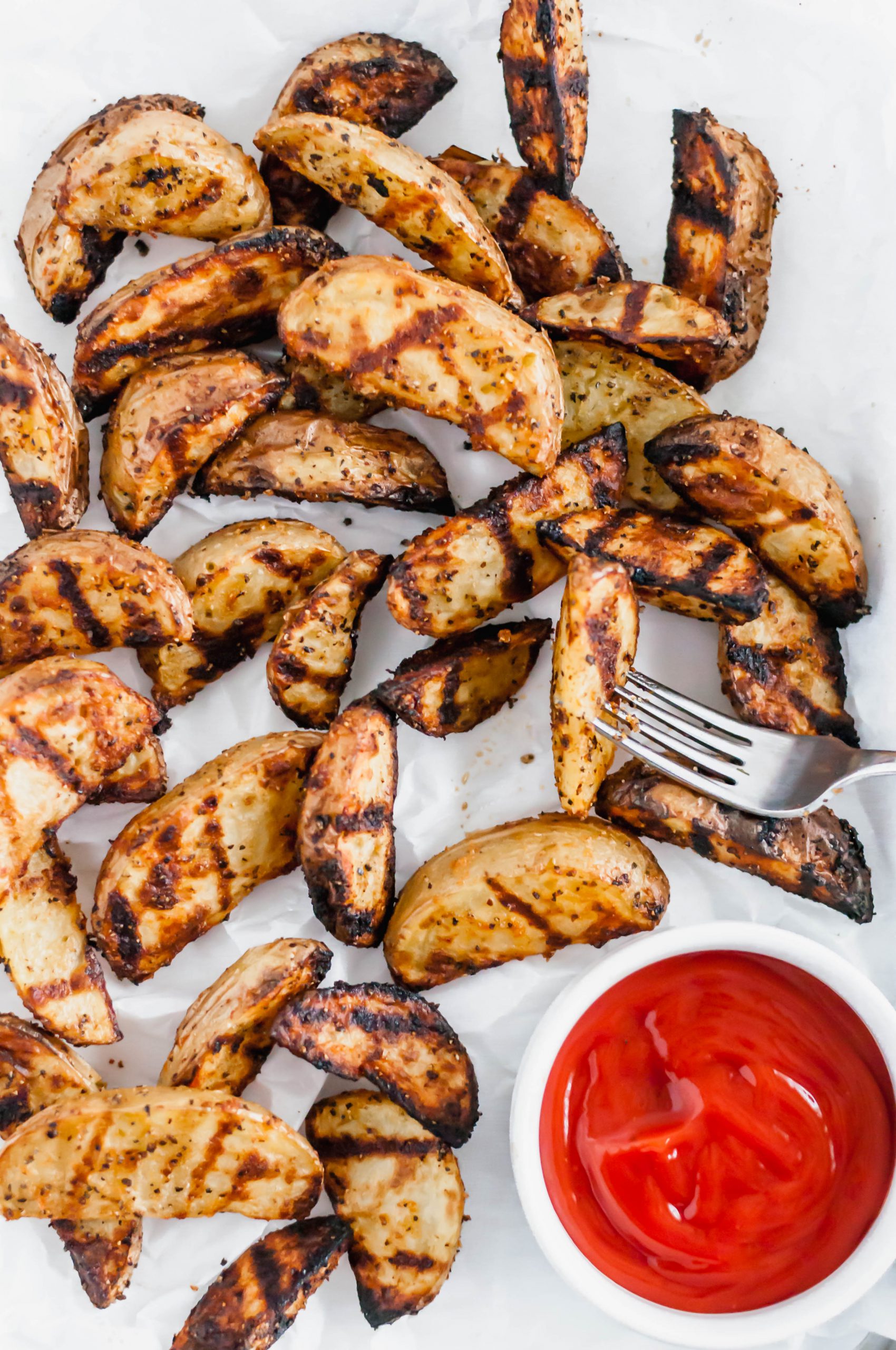 Grilled Potato Wedges are the perfect summer side dish. Done in less than 30 minutes and packed with chargrilled flavor. Great with burgers and chicken.