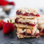 These Strawberry Crumb Bars are an amazing summer dessert. The simple shortbread crust also doubles as the crumble on top. Old-fashioned oats add a delicious chewy texture to the crust.