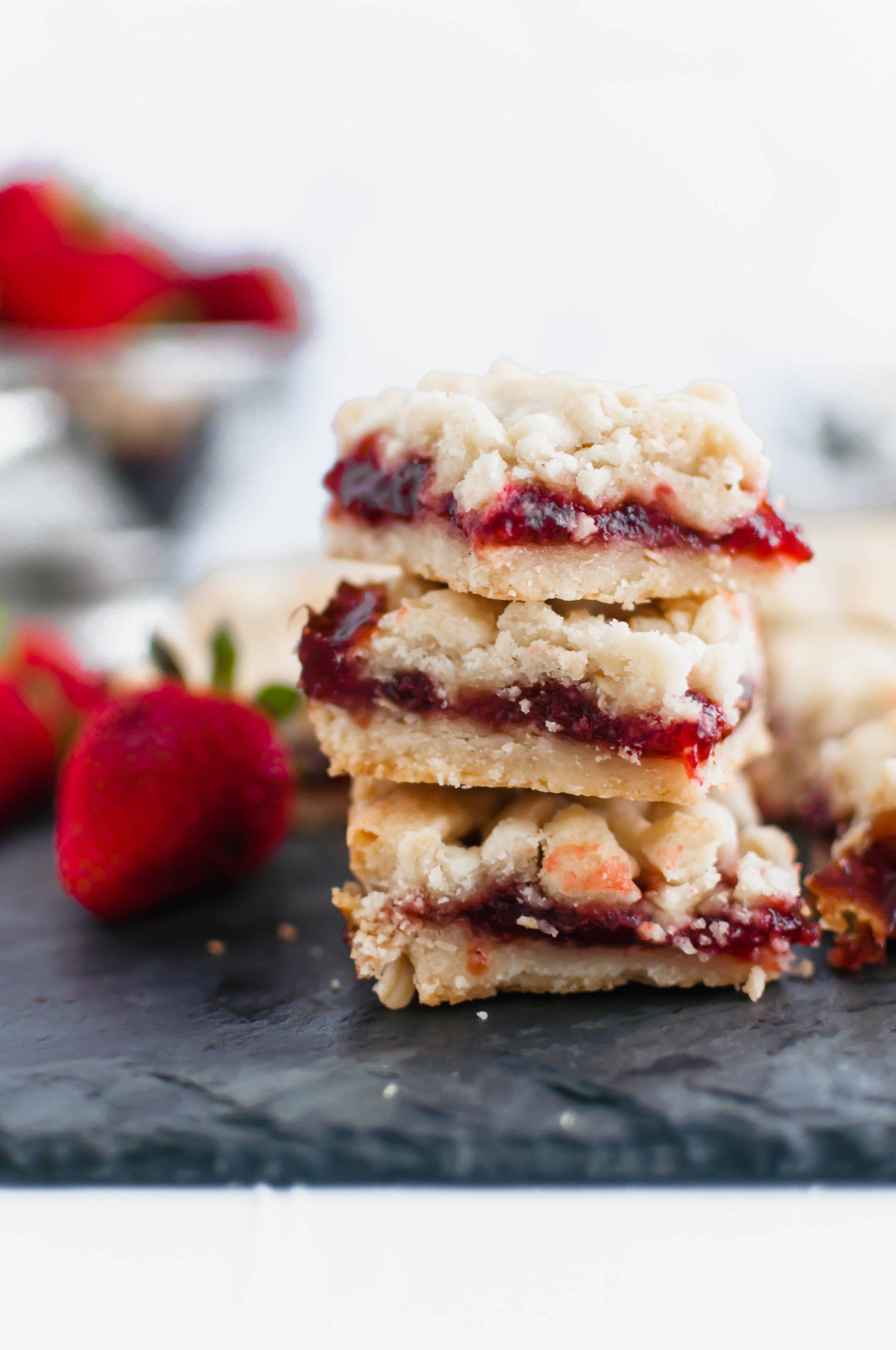 These Strawberry Crumb Bars are an amazing summer dessert. The simple shortbread crust also doubles as the crumble on top. Old-fashioned oats add a delicious chewy texture to the crust.