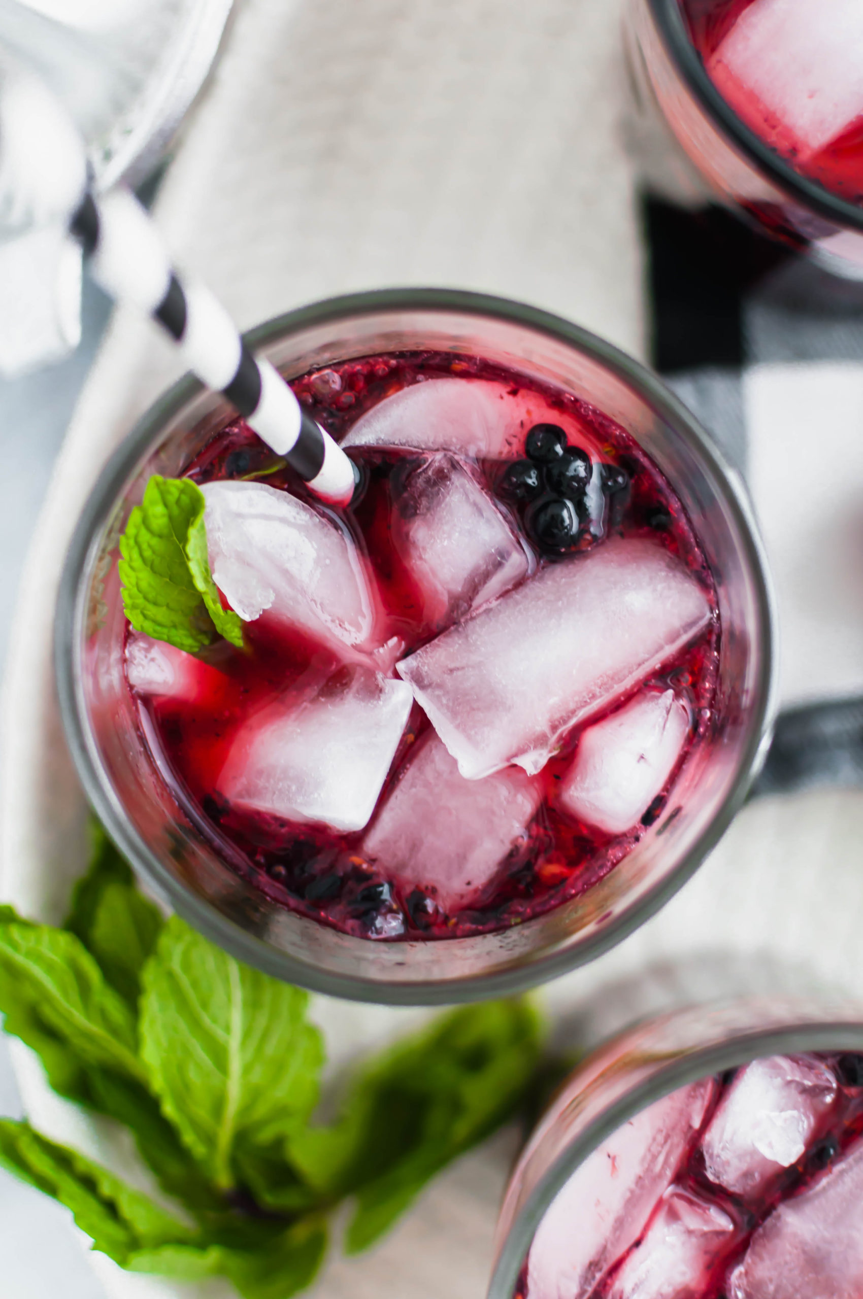 These Blackberry Mojitos will quickly become the drink of summer. An easy blackberry simple syrup and all the classic mojito ingredients are all you need for this refreshing cocktail.