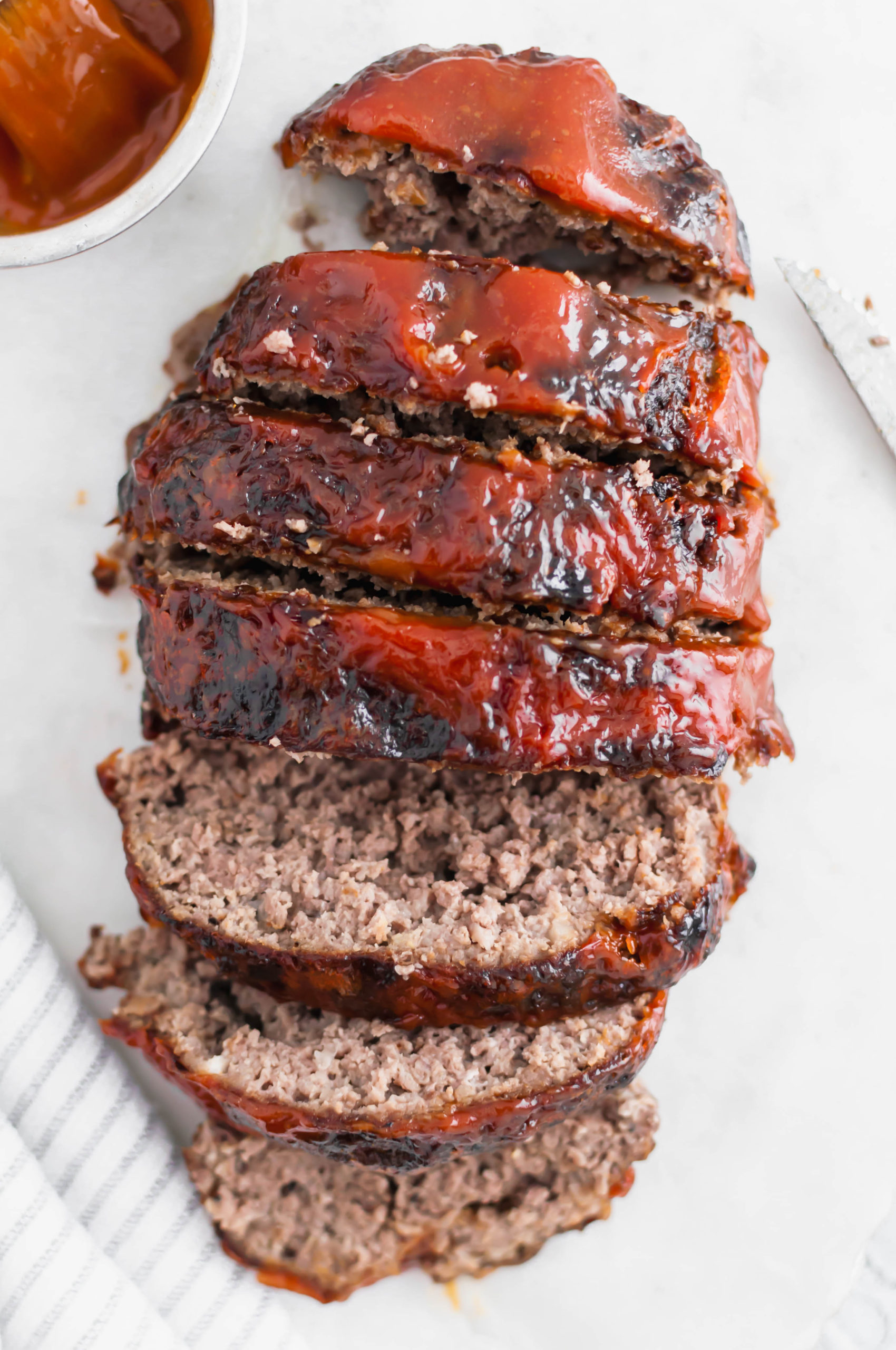 Crispy on the outside and juicy on the inside, this Air Fryer Meatloaf is simple and quick enough for a weeknight meal. Slathered with a delicious glaze to put it over the top.