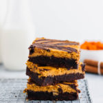 These Pumpkin Cheesecake Brownies are a must try dessert this fall. Thick, fudgy one pot brownies topped with a simple, delicious spiced pumpkin cheesecake.