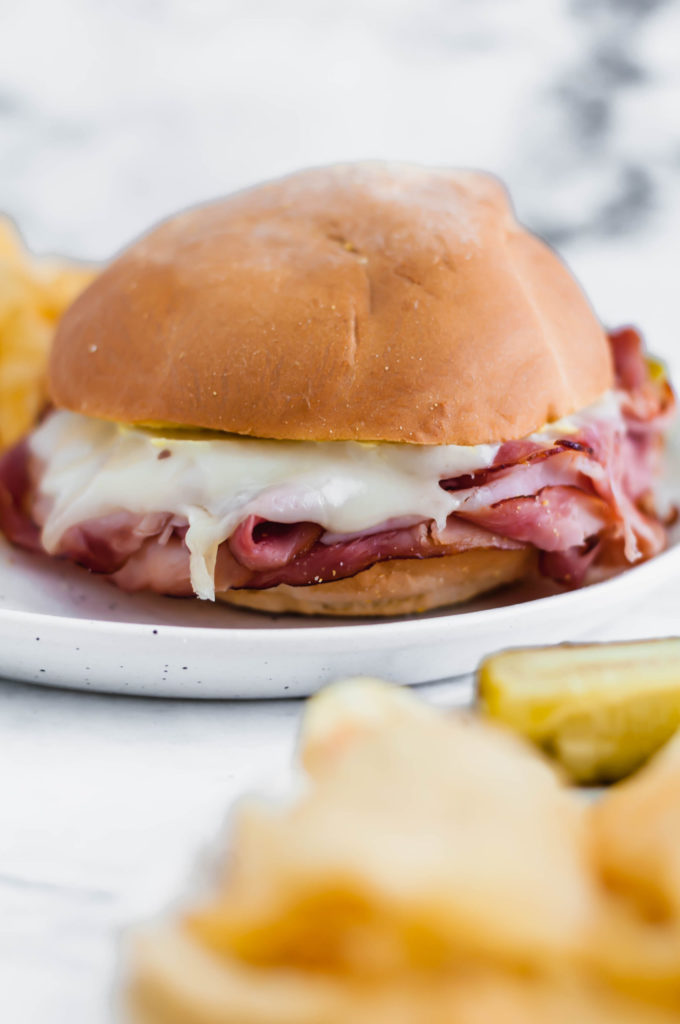 Need an easy lunch or weeknight meal? These Hot Ham and Cheese Sandwiches are the perfect solution. Shaved deli ham (honey ham is my favorite) with melted swiss cheese and a yummy sauce.