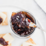 Bacon Onion Jam is a delicious, sweet and savory condiment that is going to blow your mind. Smoky bacon, red onions, sugar and vinegar are cooked down to create a thick, caramelized jam that is delicious on crackers, sandwiches, brie and more.