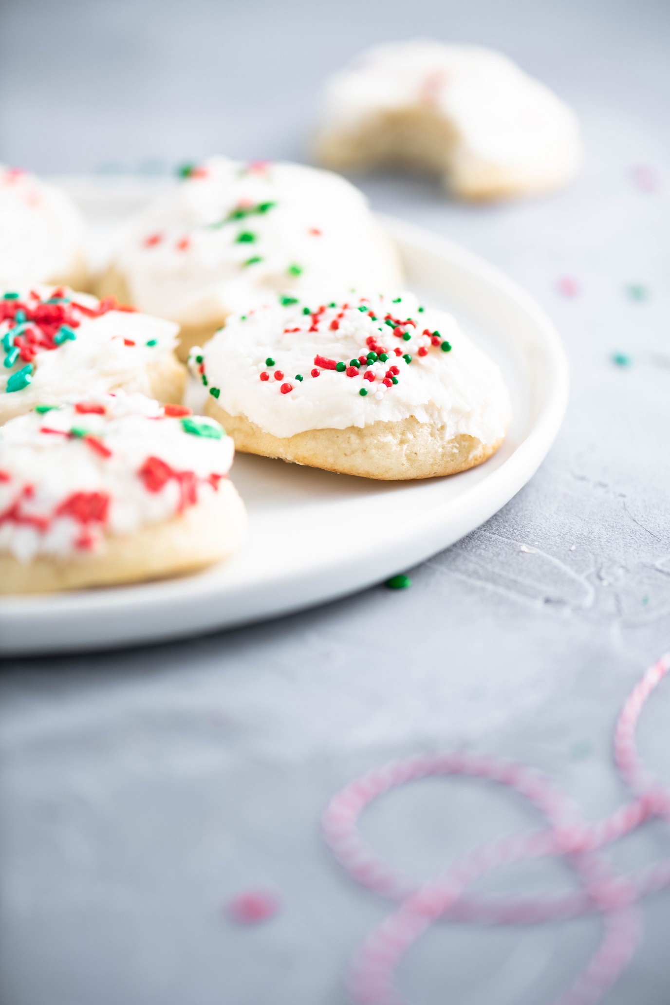 These Italian Christmas cookies are the most tender, fluffy cookie around. With a cake-like texture and a not too sweet buttercream frosting, these are the perfect Christmas cookie. Decorate with festive sprinkles to make them extra fun.