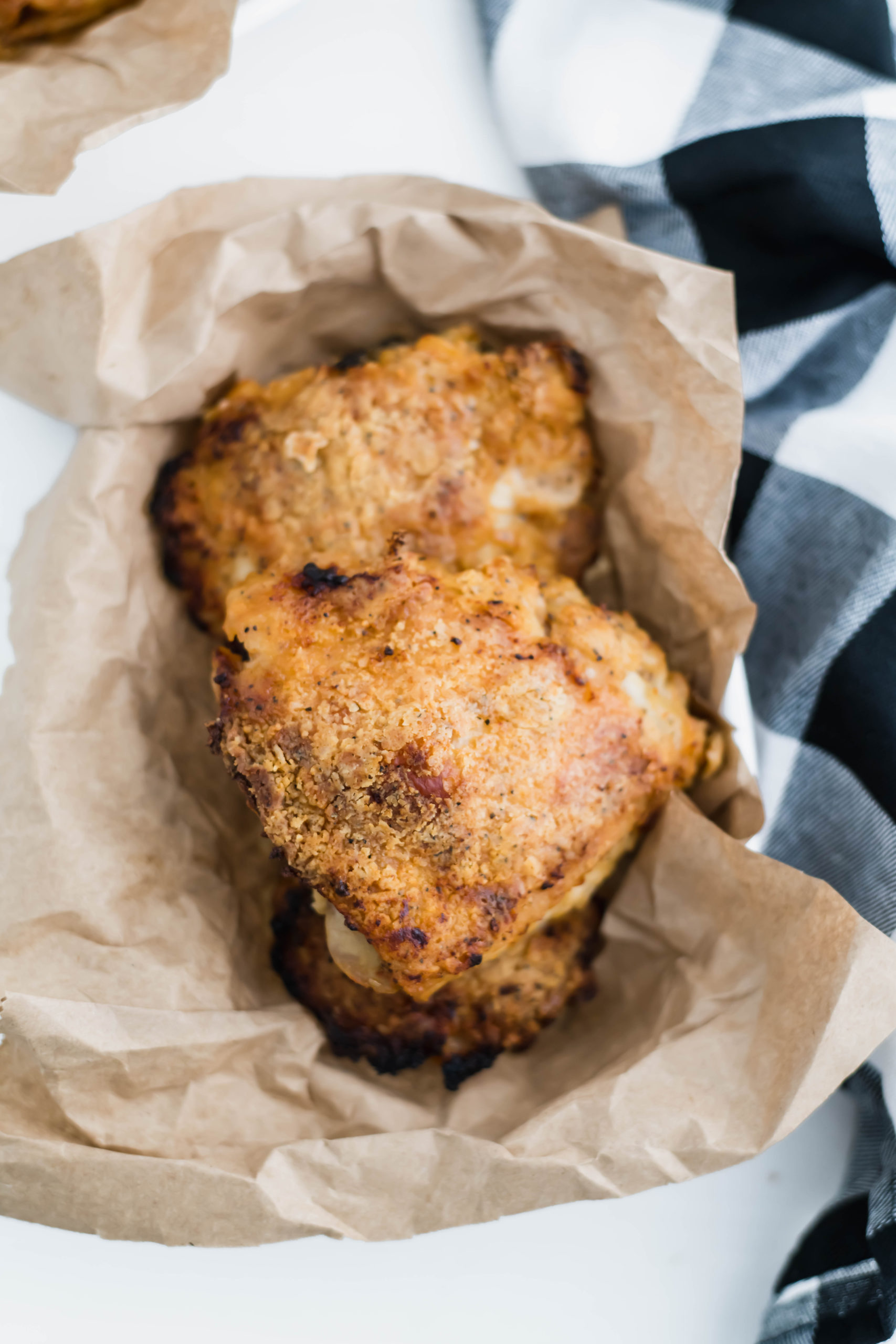 Love fried chicken but hate frying food at home?! This Oven Fried Chicken is perfeclty crispy, juicy and super flavorful. Perfectly spiced and super tender from a buttermilk marinade.