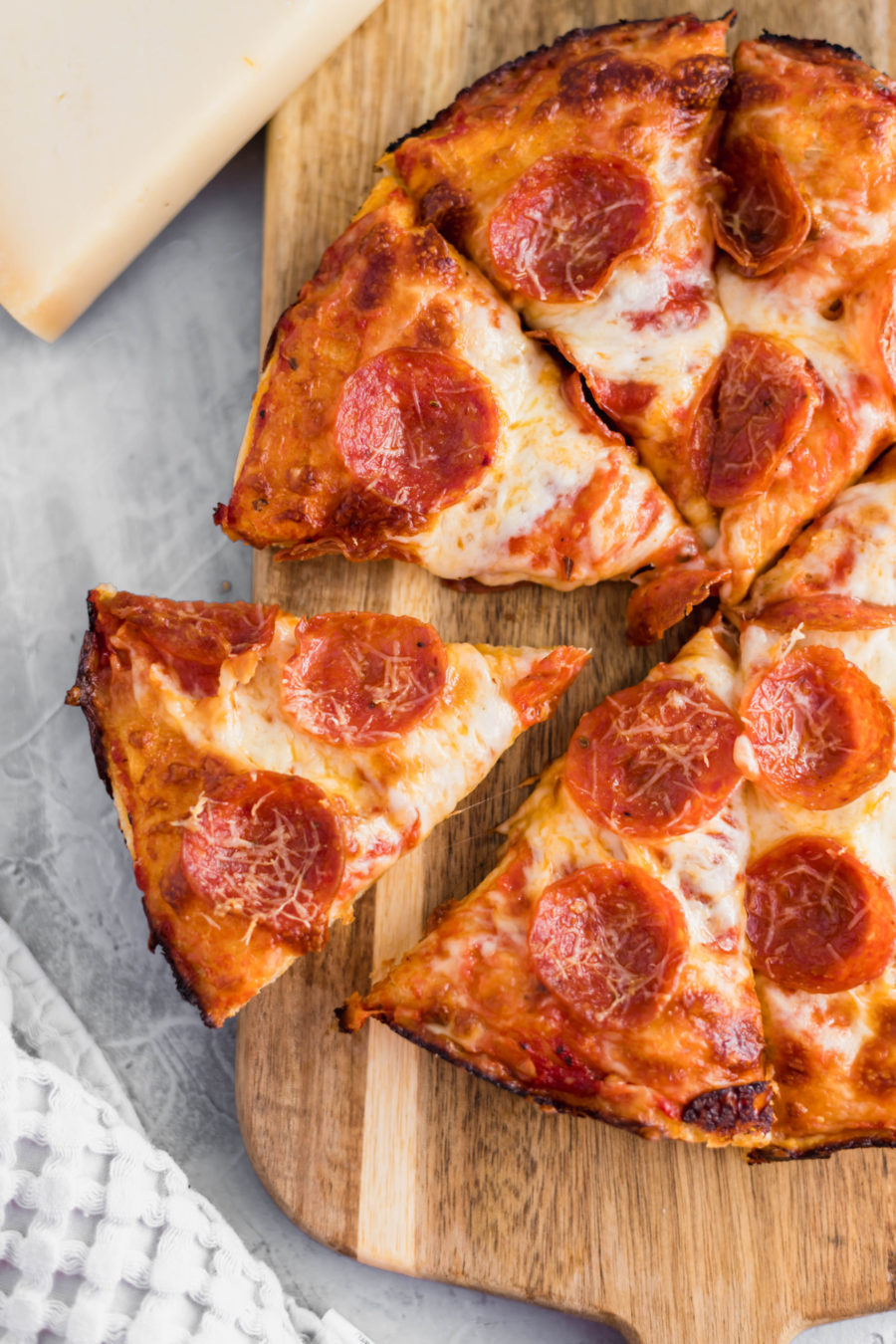 Movie night just got a whole lot better with this Cast Iron Skillet Pizza. It has the perfect crispy bottom and is topped with your favorite pizza toppings.