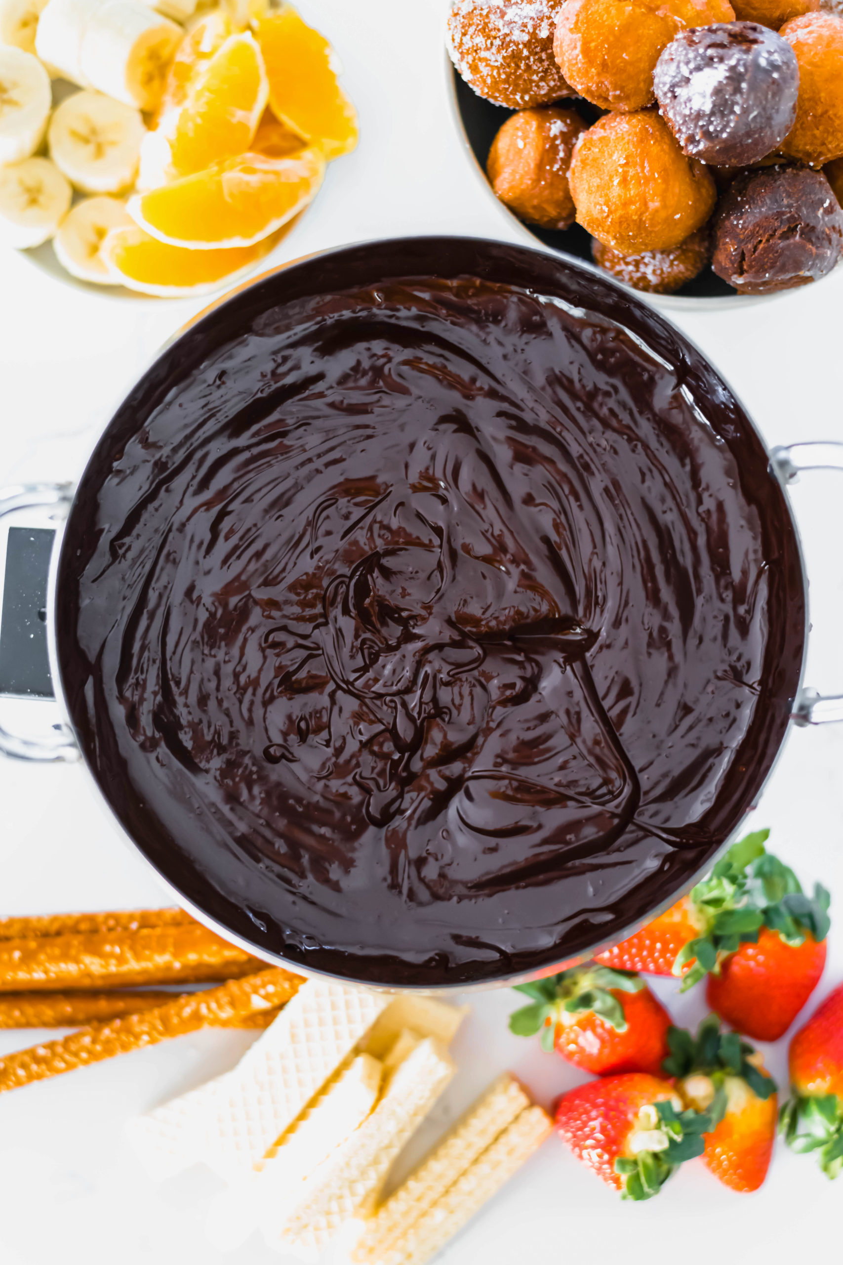 Serve Chocolate Orange Fondue, a fun twist on the classic chocolate fondue, for Valentine's Day dessert. Prepared in minutes with the perfect chocolate orange flavor combo.