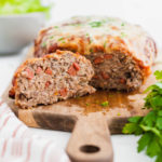 Two dinnertime favorite collide with this Pizza Meatloaf. Pizza ingredients throughout the meatloaf and on top puts that pizza flavor over the top.