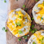 Looking for a delicious breakfast or fun dinner? These Mini Breakfast Pizzas start with a store-bought biscuit crust, topped with a simple sausage gravy, fluffy scrambled eggs and cheese.