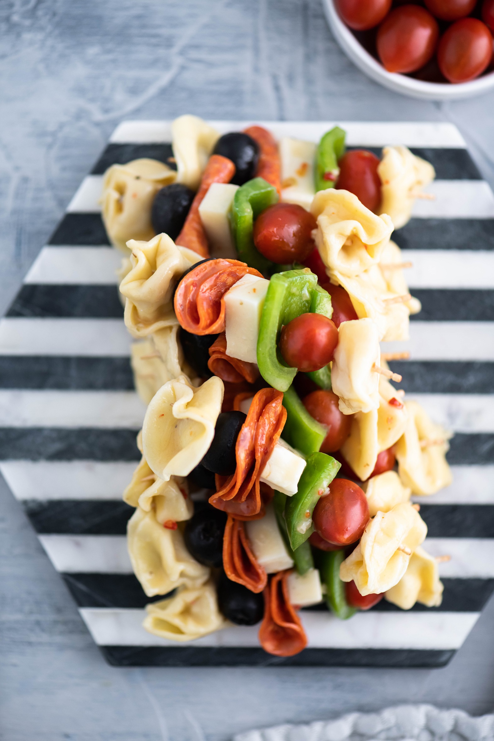 Looking for a fun appetizer or creative lunch box addition? Pasta Salad on a Stick takes all the classic pasta salad ingredients and threads them on a long toothpick for a delicious new spin. Perfect for parties and afternoon snacks alike.
