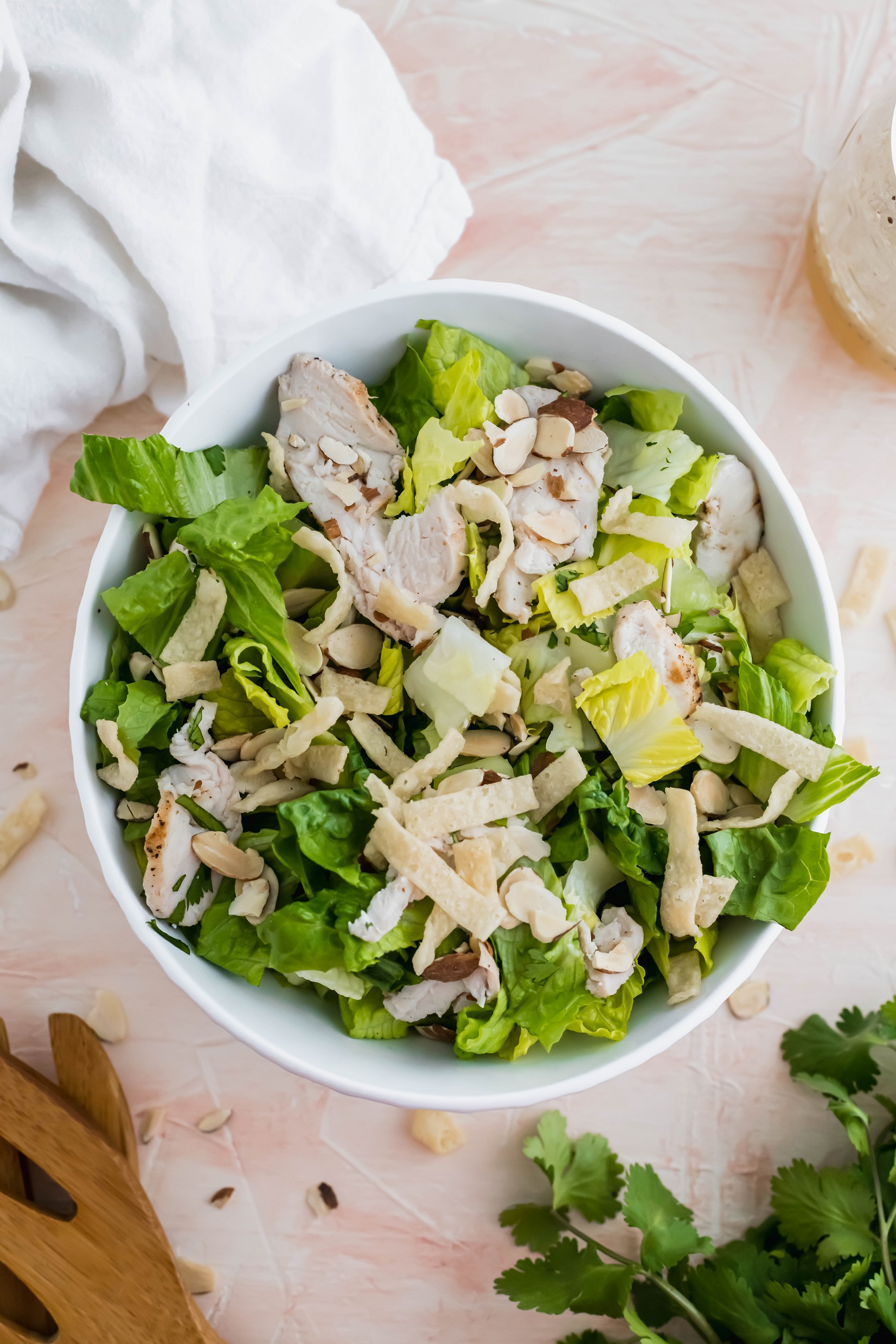 Make your favorite salad at home with this recipe for Panera's Asian Sesame Chicken Salad. It tastes JUST like the restaurant version at a fraction of the cost.