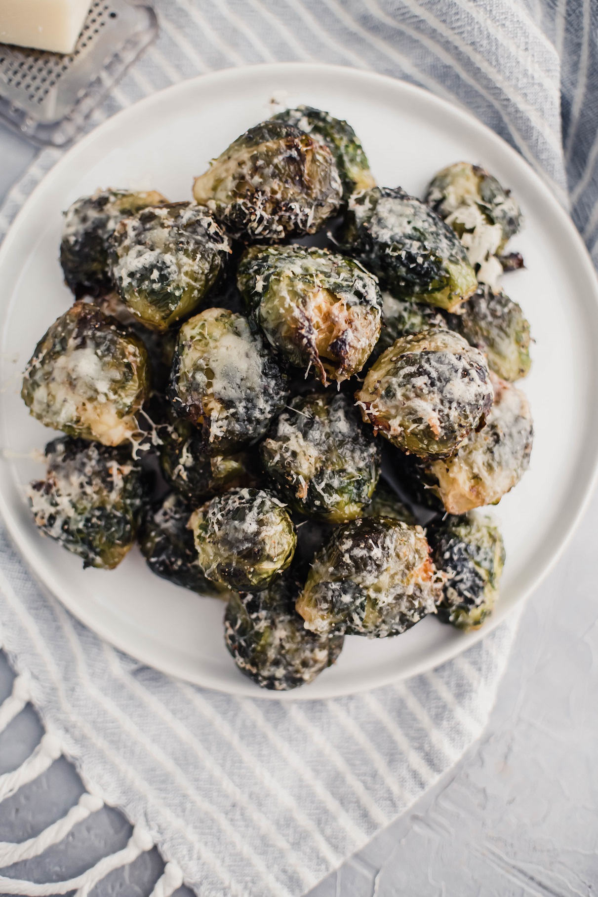 Get ready for Thanksgiving with this new delicious side dish, Parmesan Smashed Brussels Sprouts. They are extra crispy and super cheesy.
