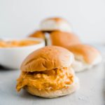 Close up of shredded buffalo chicken sandwich.