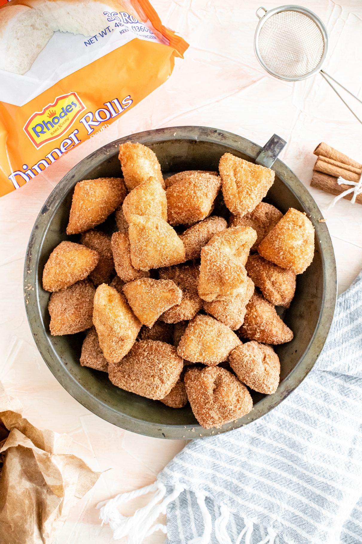 Vintage pie plate filled with cinnamon sugar donut holes.