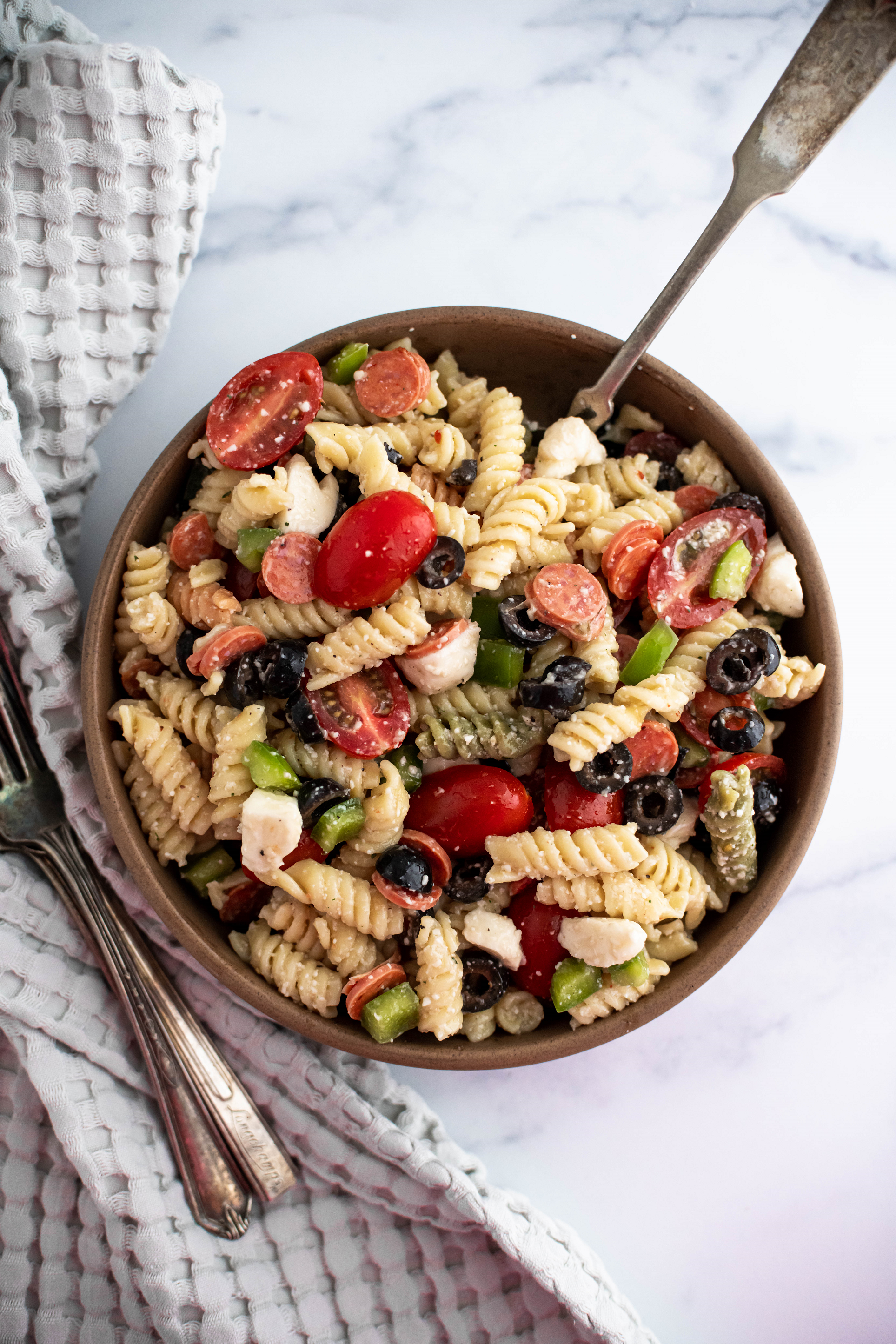 Bowl filled with pizza pasta salad.